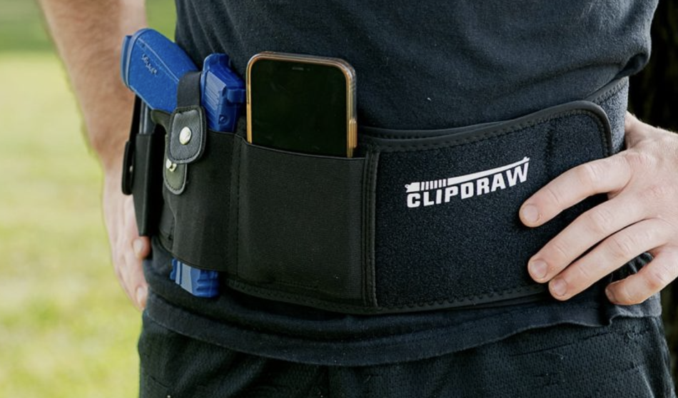 A responsible gun owner wearing a Clipdraw Belly Band Holster over top of their clothing.